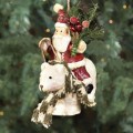 santa with pine bough and polar bear ornament